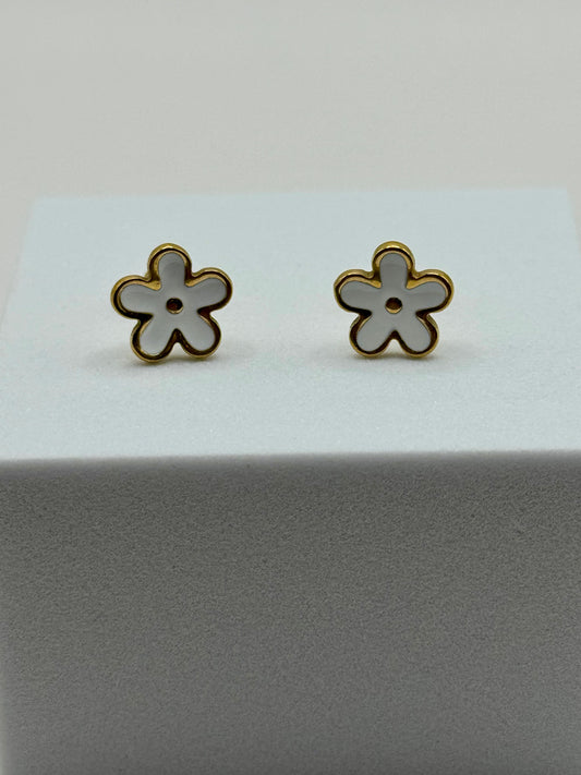 The Gardenia Earrings floral stud pair displayed against dark backdrop showing gold plating detail.