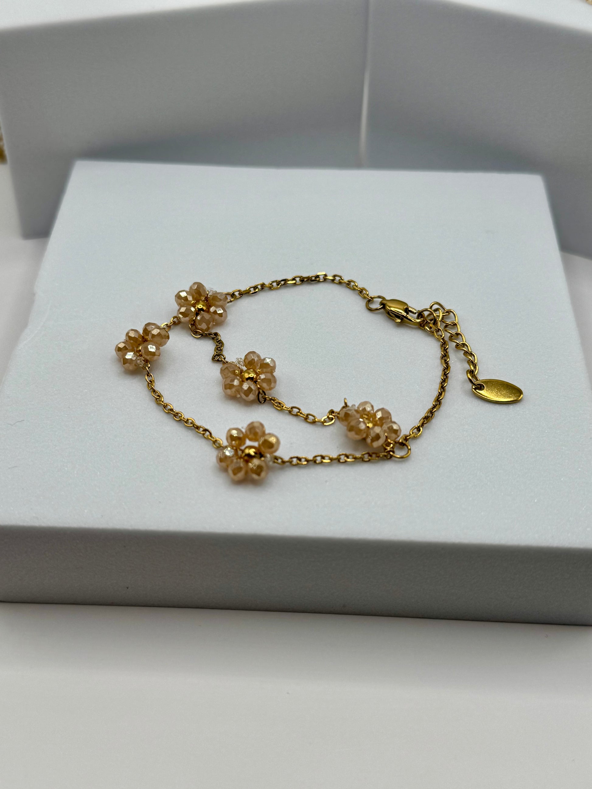 Close-up of The Fleurette Bracelet floral chain design with adjustable lobster clasp.