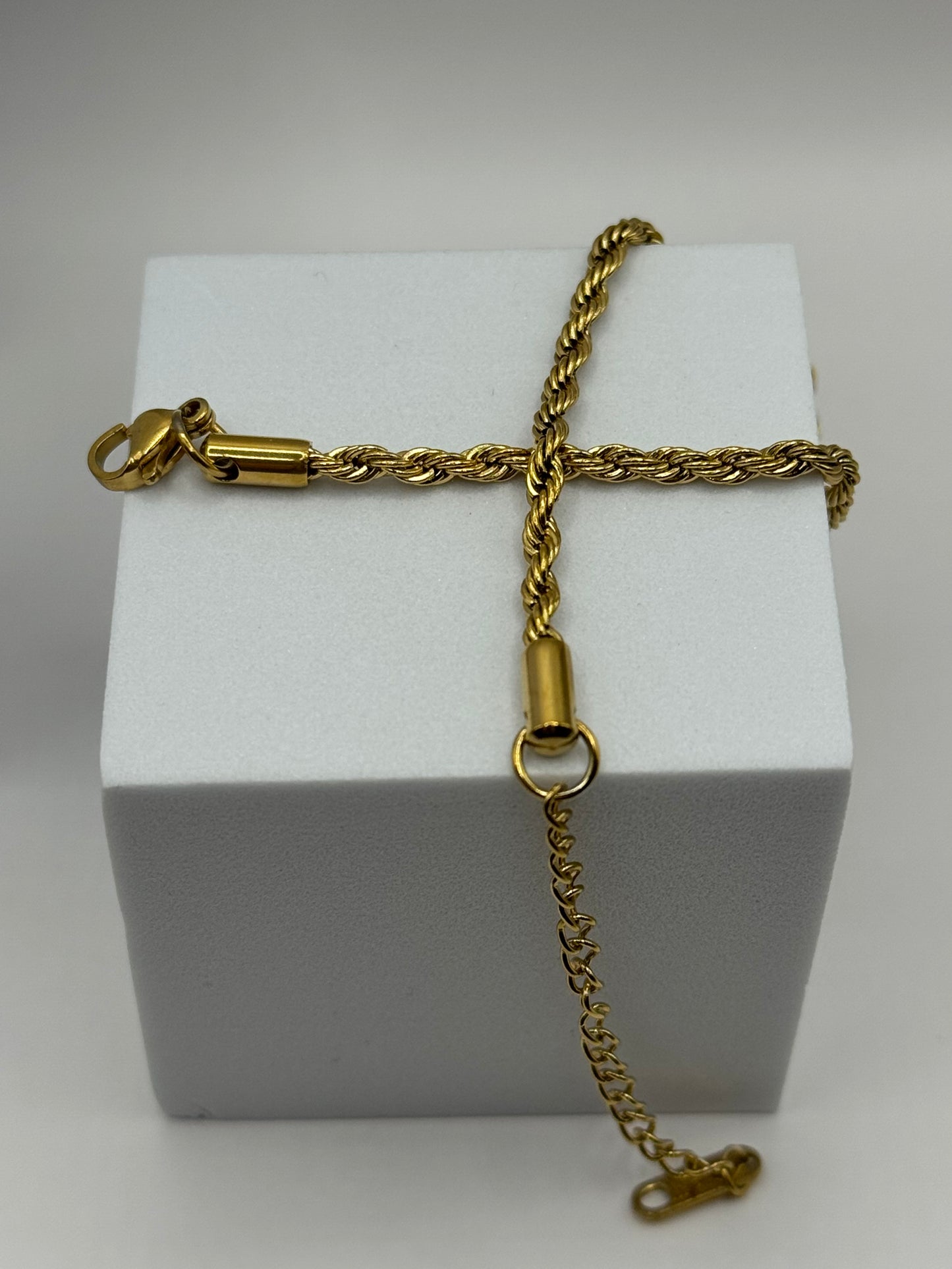 Close-up of The Livara Bracelet, gold 3mm rope chain with lobster clasp and adjustable extension.