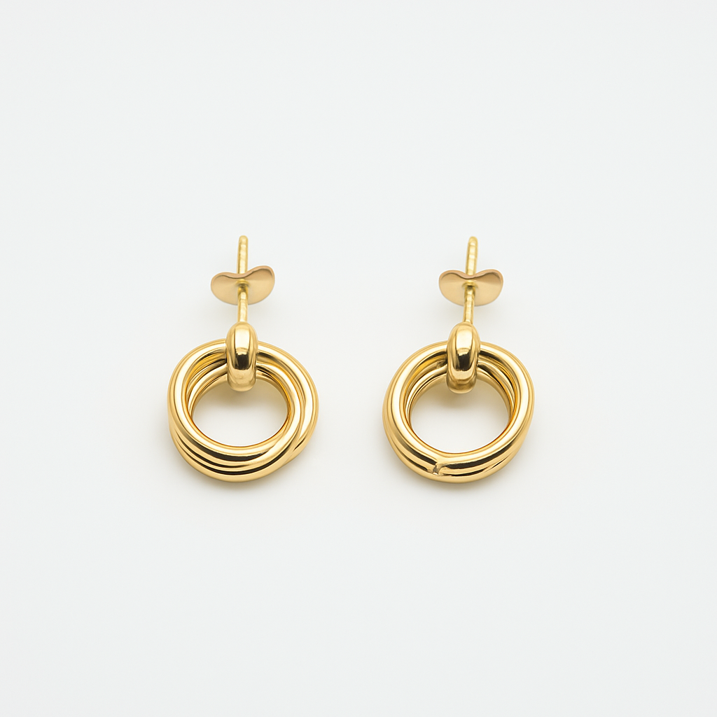 The Entwined Earrings close-up of gold double-ring stud design on white background.