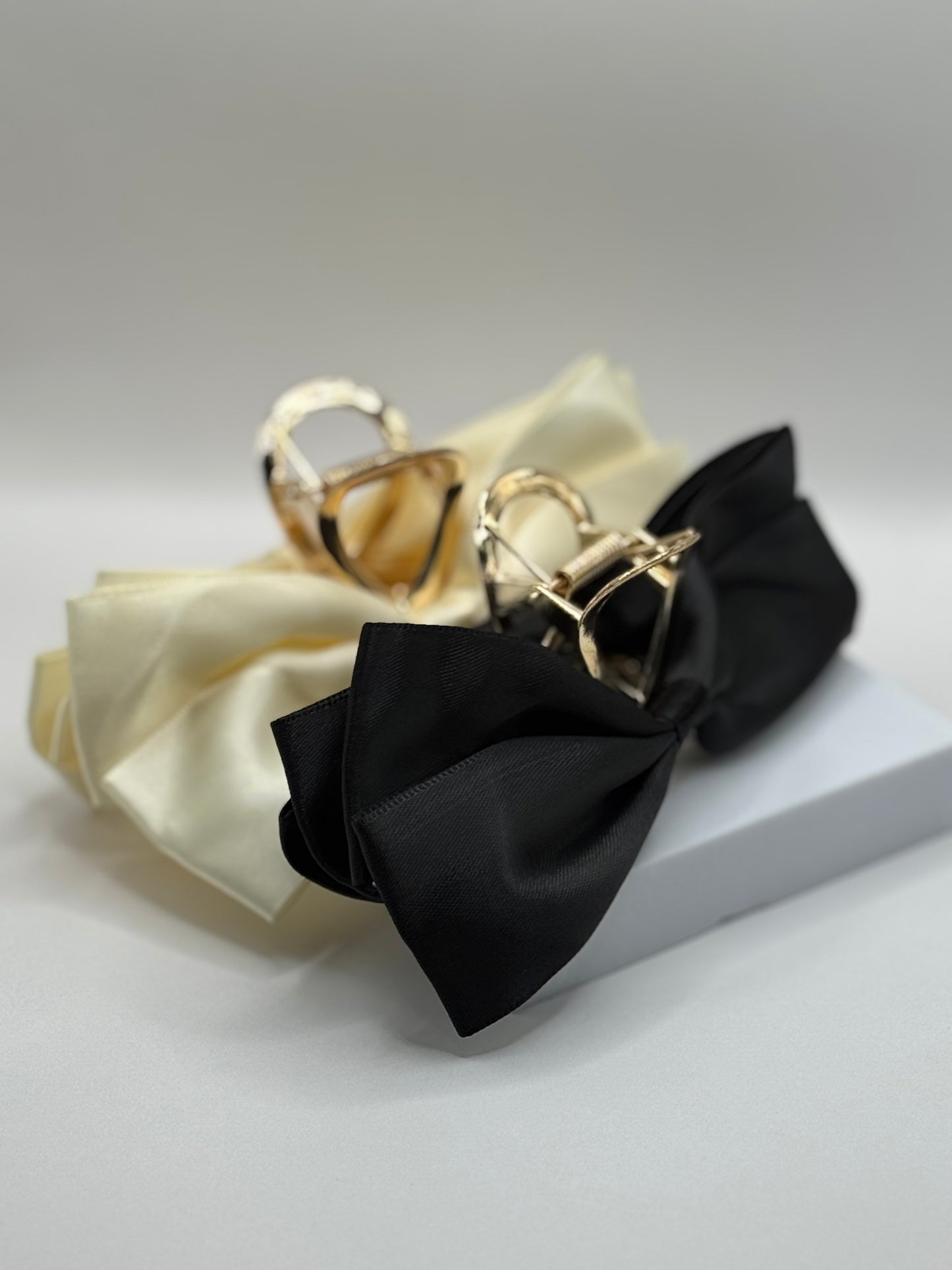 EMPIECE™ Paloma Hair Clip in ivory satin bow with gold metal claw, luxe hair accessory.