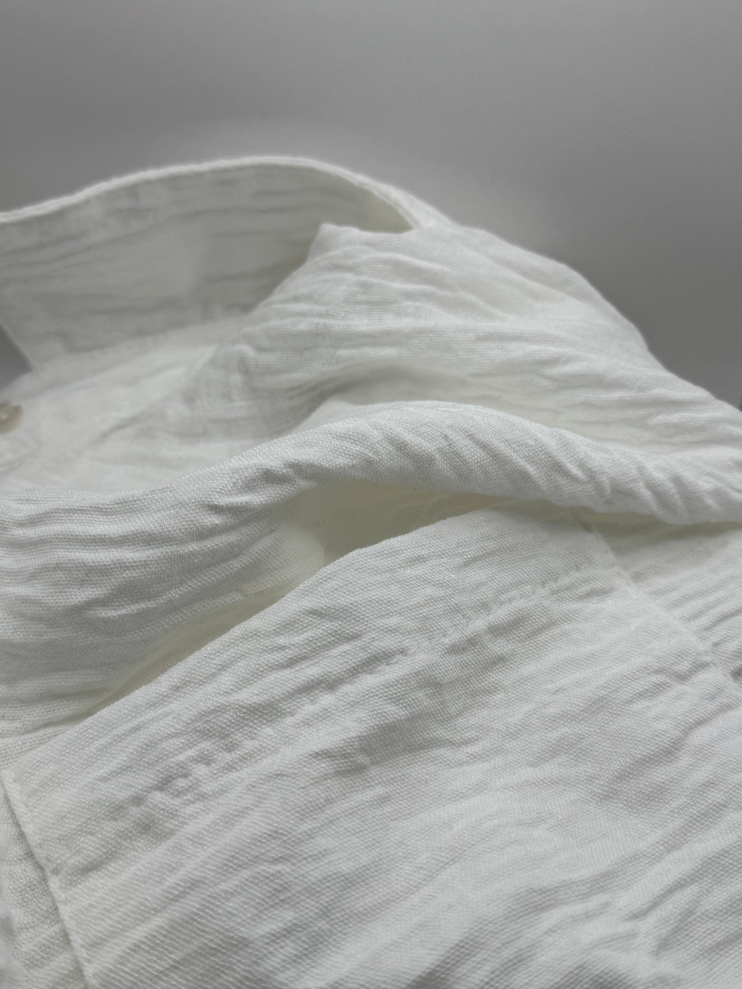 Close-up of the soft viscose-linen blend fabric of The Clarity Whisper Top, showing its natural drape and airy texture.