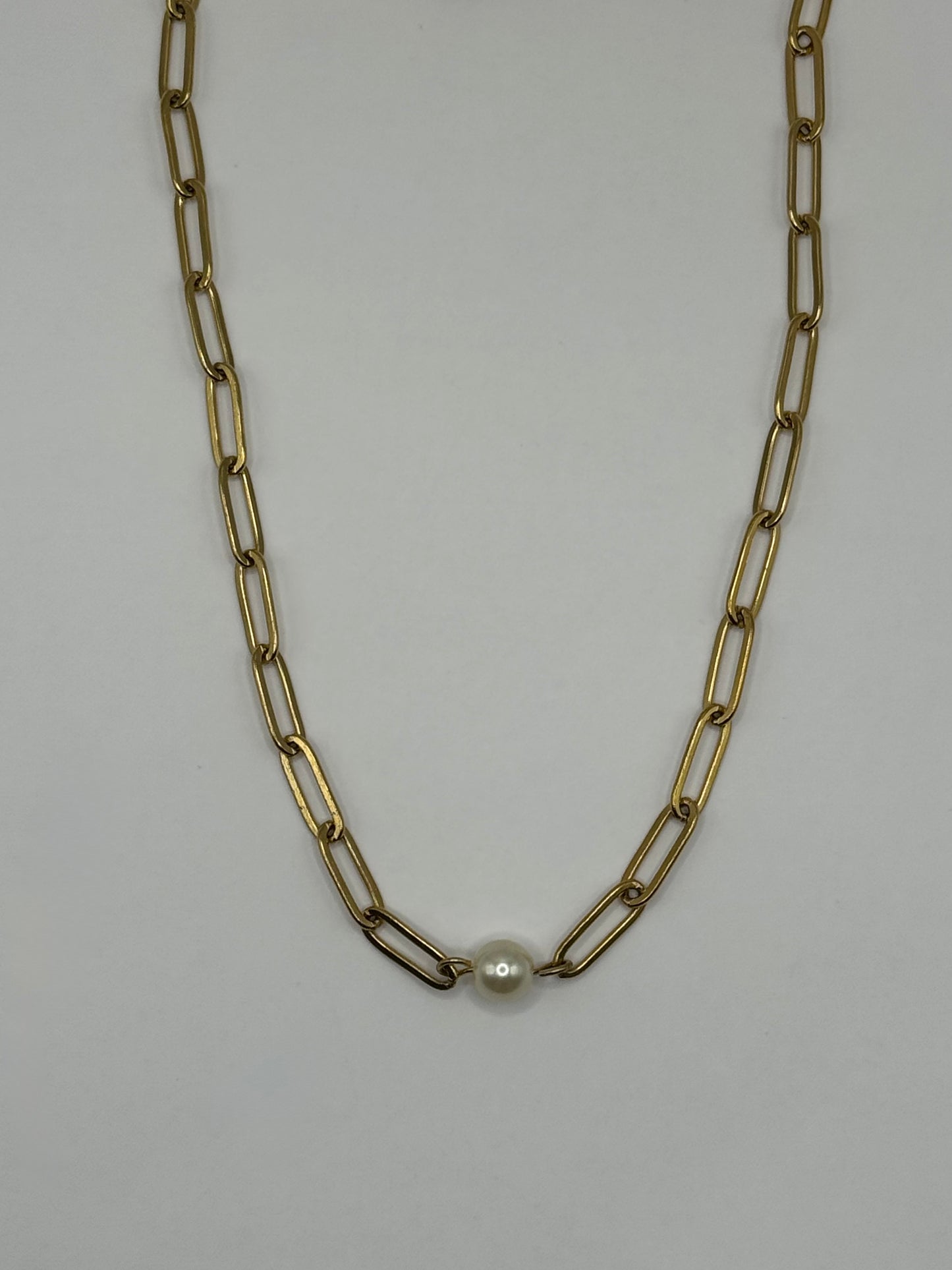 Gold paperclip chain necklace with single pearl accent centered on white background, The Margaux Necklace by EMPIECE™.
