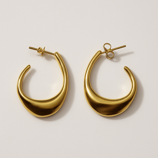 Pair of sculptural gold C-shaped hoop stud earrings, The Virelle Earrings by EMPIECE™. 